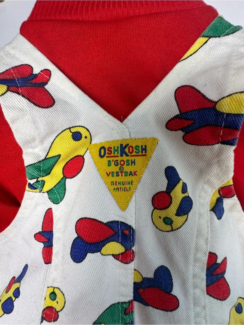 OshKosh B'gosh White Overalls with Colorful Airplane Print and Red Accents